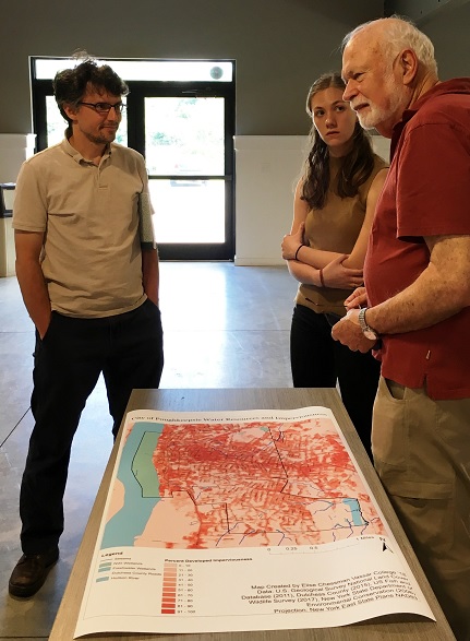 Stakeholders in conversation around a map from the Poughkeepsie NRI - Photo by L Heady