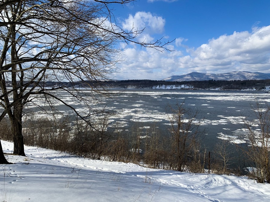 winter view of the Hudson River with the Catskill Mountains in the distance