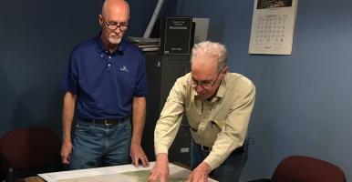 Two Town of Wawarsing officials review a map at town hall. Photo by L. Heady