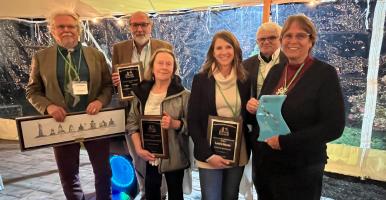 Six awardees hold their plaques at the Hudson River Environmental Society awards event in 2022.
