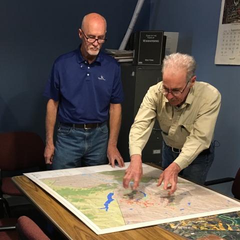 Two Town of Wawarsing officials review a map at town hall. Photo by L. Heady