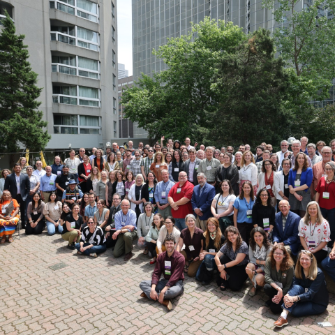 Large group of summit attendees in downtown Montreal